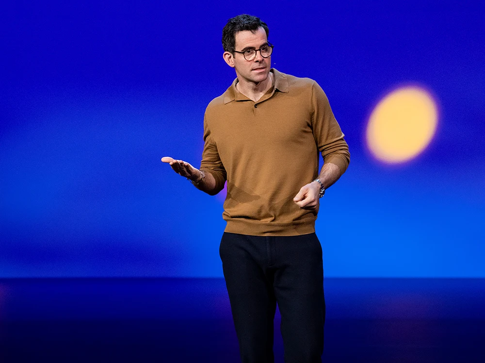 Adam Mosseri, on stage speaking at TED Talk