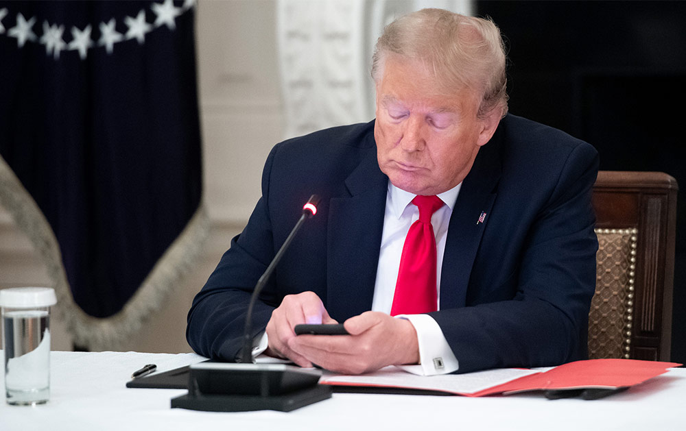 Donald Trump using his phone