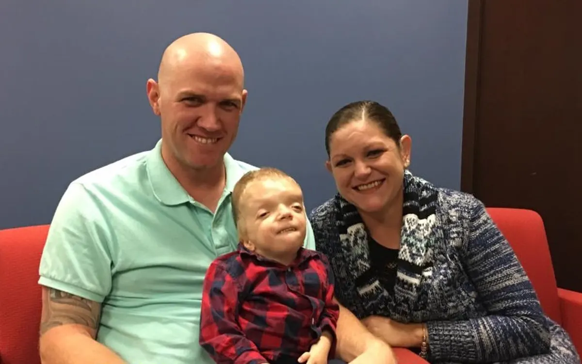 Grayson Smith with father and mother.