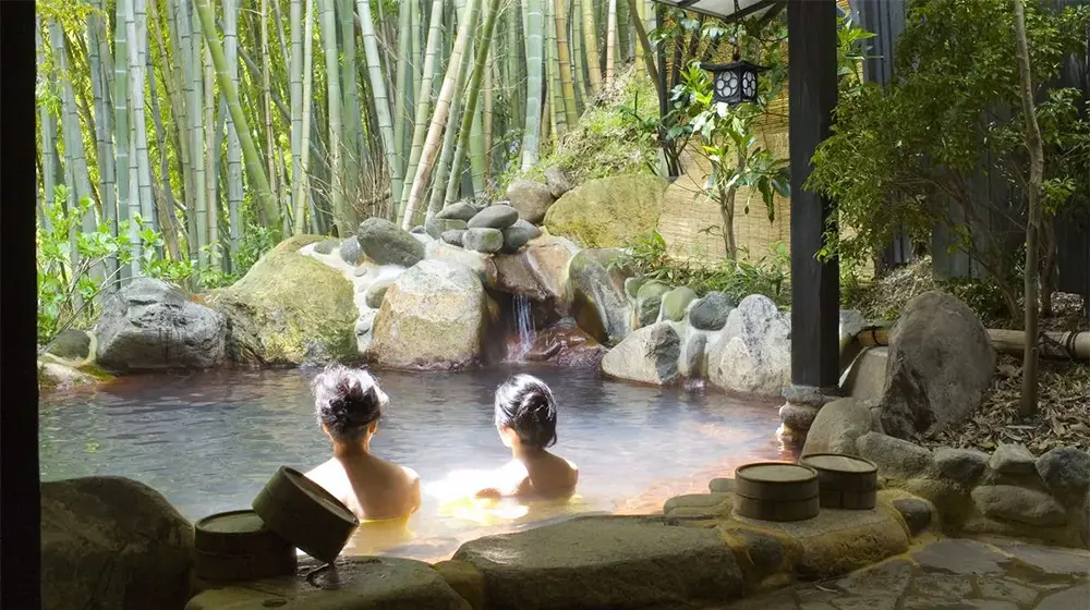 Women bathing in a hot spring at a resort in Kurokawa Onsen in Minamioguni, Japan.