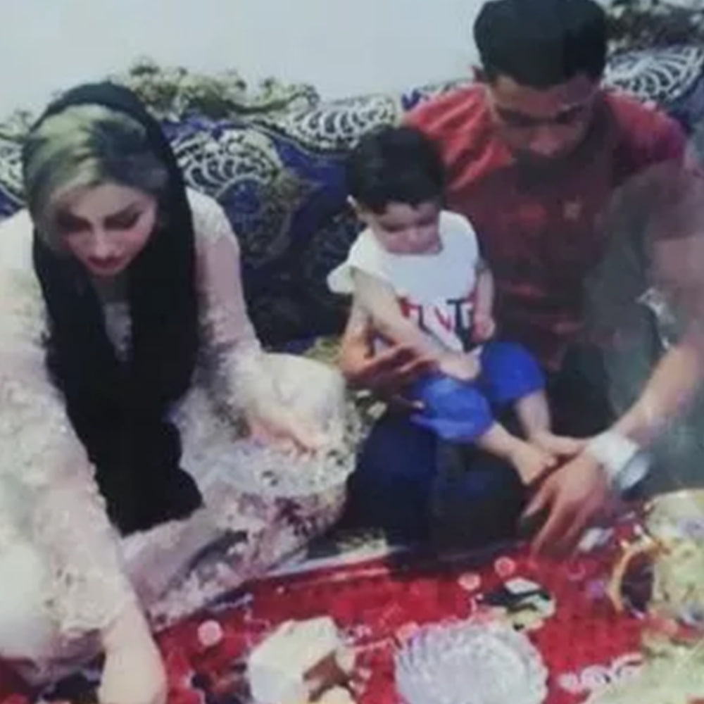 Mona Heydari, with Sajjad Heydari and their child