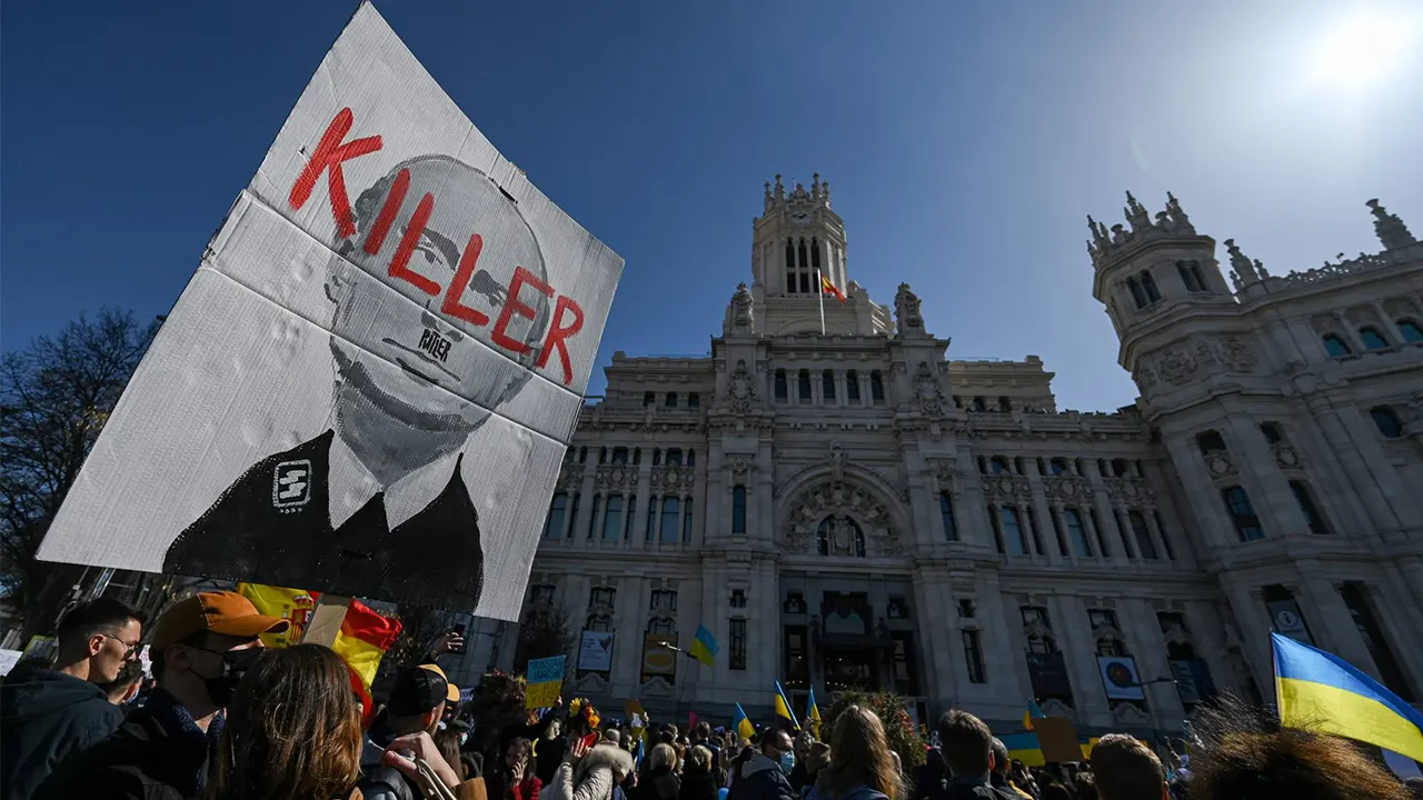 Demonstrators protest against Vladimir Putin and the Russian invasion of Ukraine in front of the Cibeles Palace