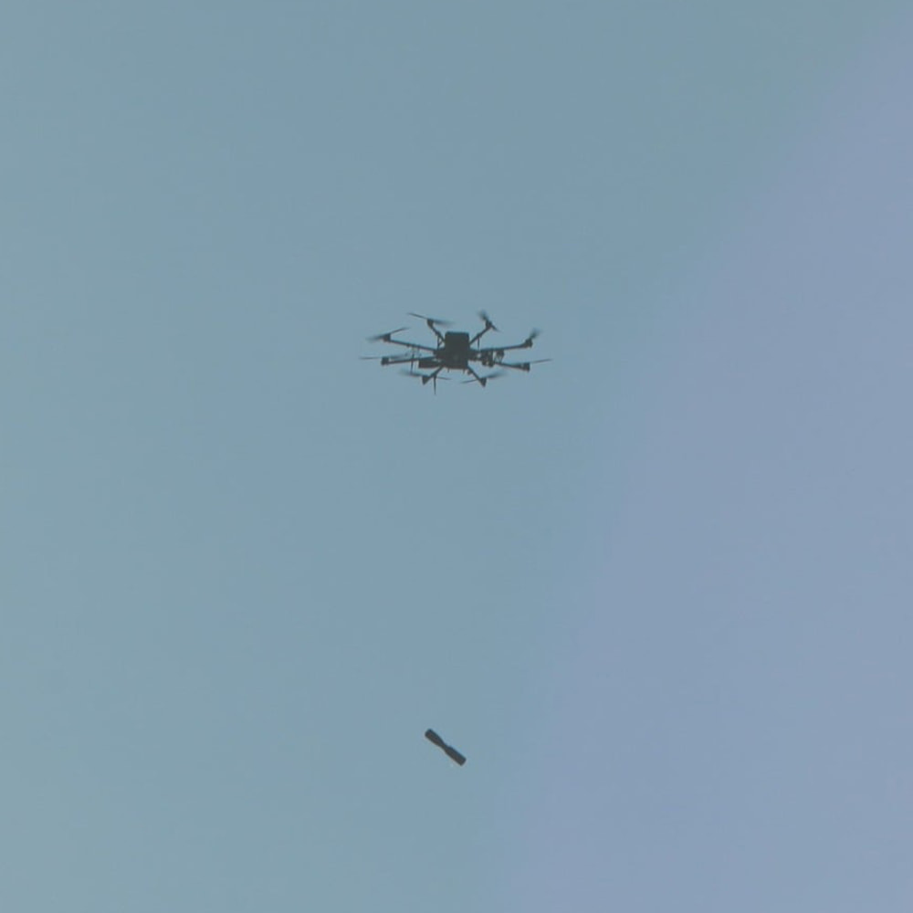 A R18 reusable strike drone releasing a RKG-1600 anti-tank grenade