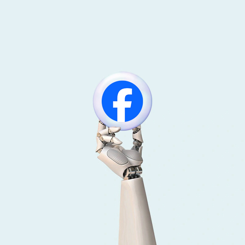 Robot hand holding Facebook