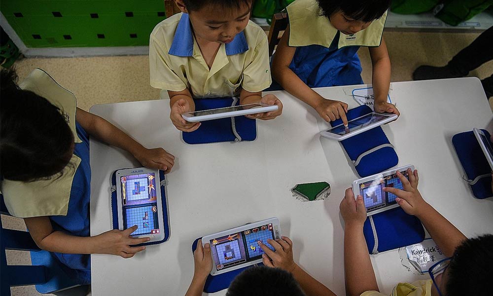 Children at Carpe Diem Juniors playing the Manta Match Mania game