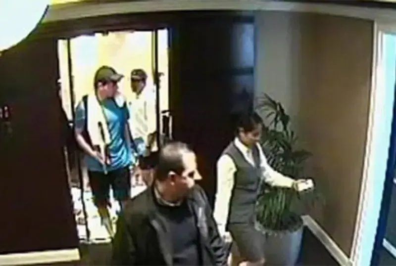 Mahmoud Al-Mabhouh, a Hamas high-ranking official in a Dubai hotel, with his assassin behind him