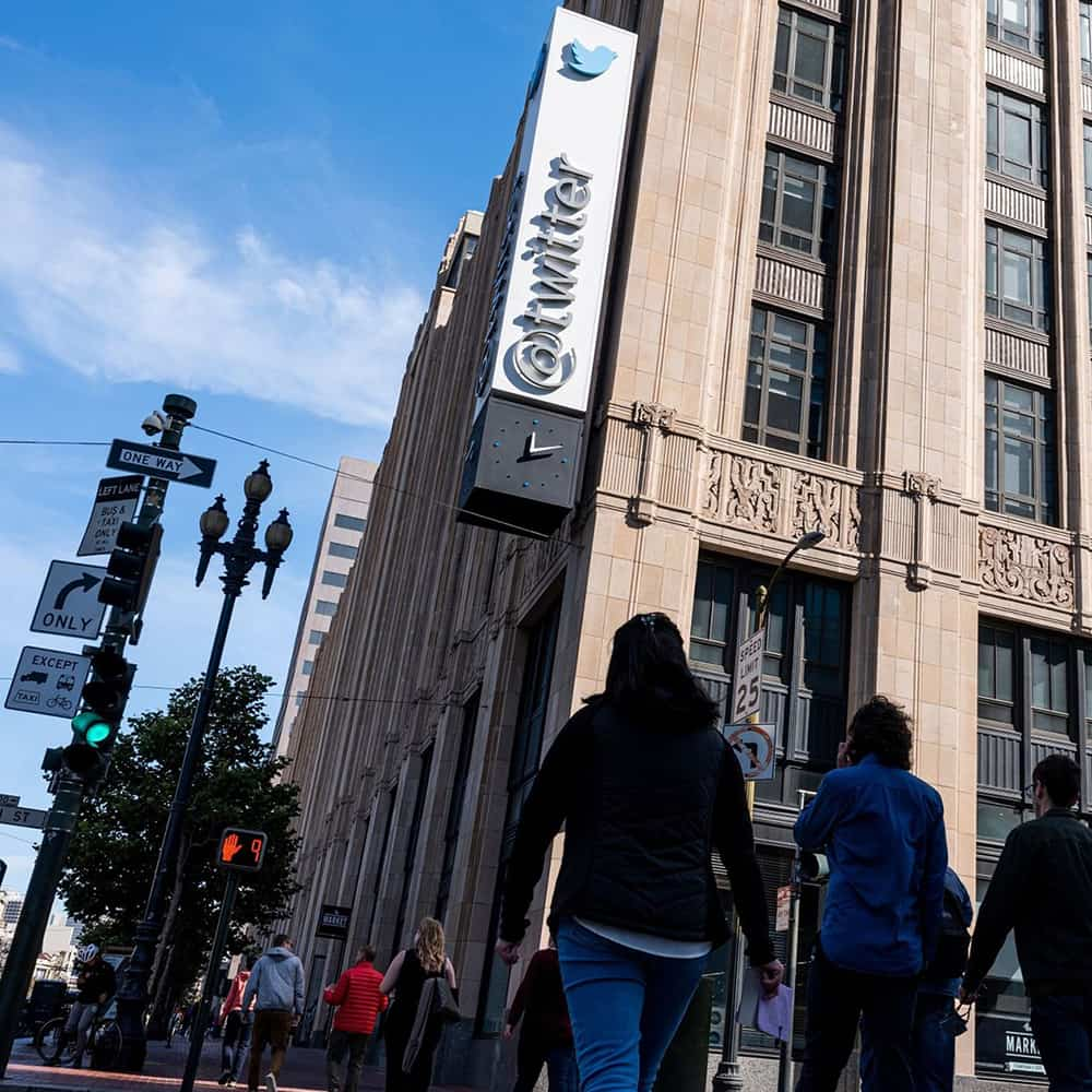 Pedestrians outside Twitter headquarters in San Francisco on October 6, 2022