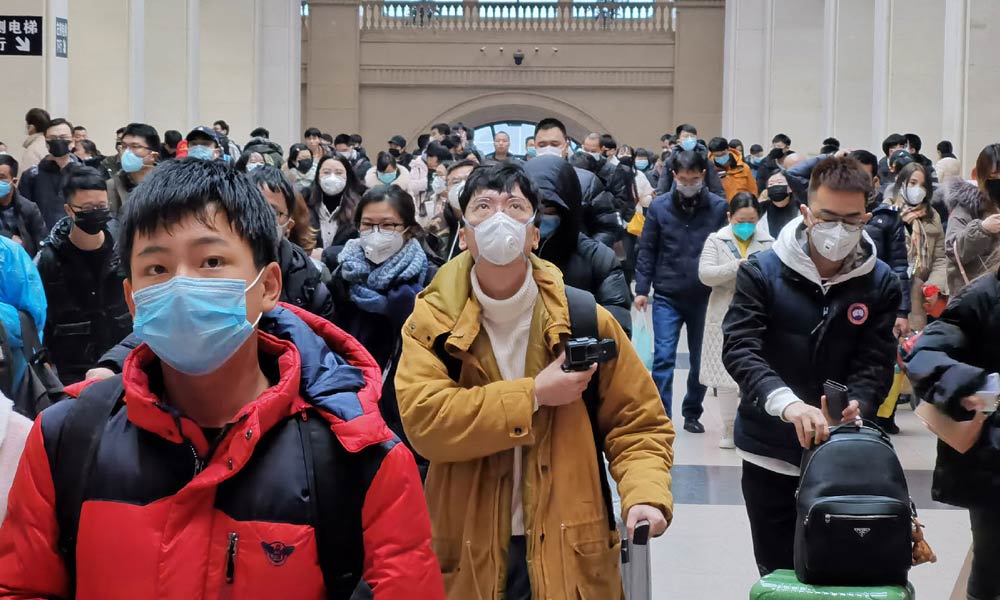 People wearing face masks at Hankou Railway Station
