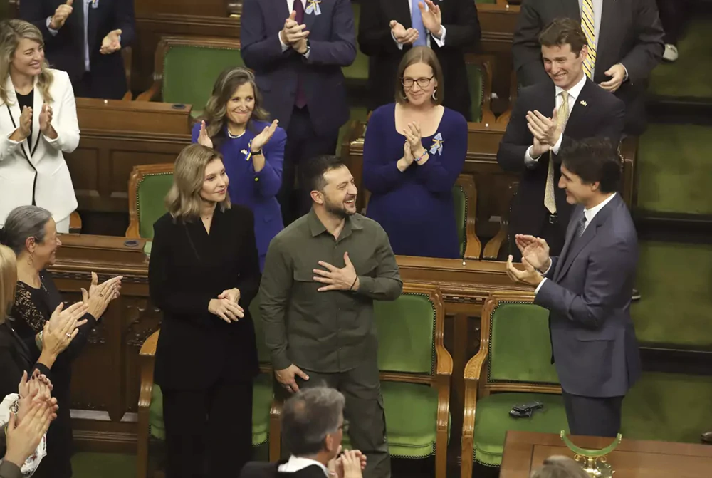 Ukrainian President Volodymyr Zelenskyy receives a standing ovation from Canadian Prime Minister Justin Trudeau